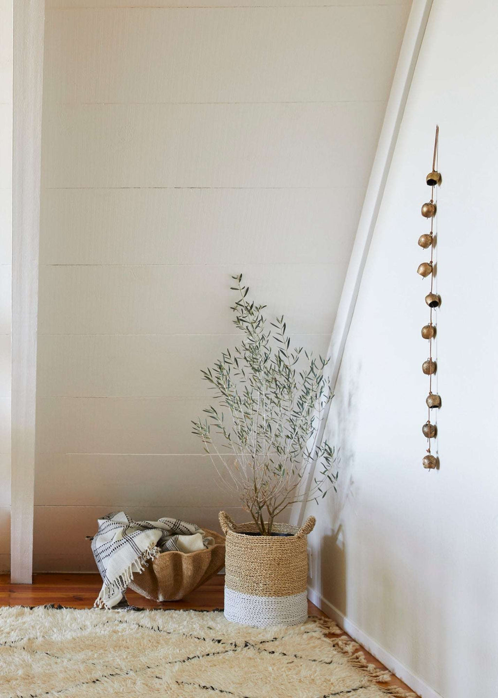 Vintage string of bells handcrafted from authentic Indian bells on leather cord for artisanal home decor
