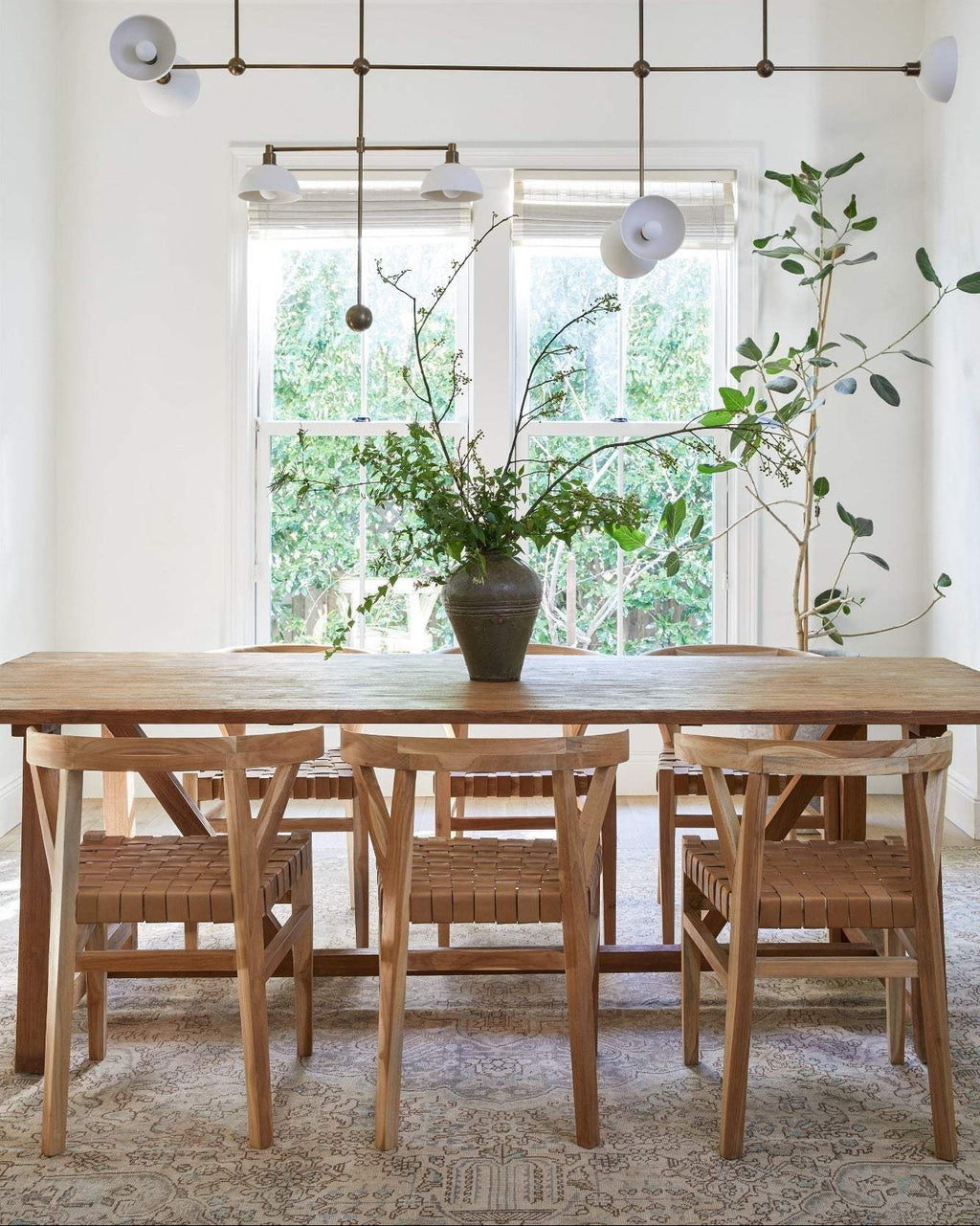 Handcrafted woven leather Wishbone dining chair with teak frame and beige leather seat, second quality with natural imperfections