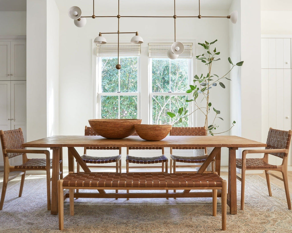 Woven leather bench with saddle-colored leather straps and teak frame with turned legs