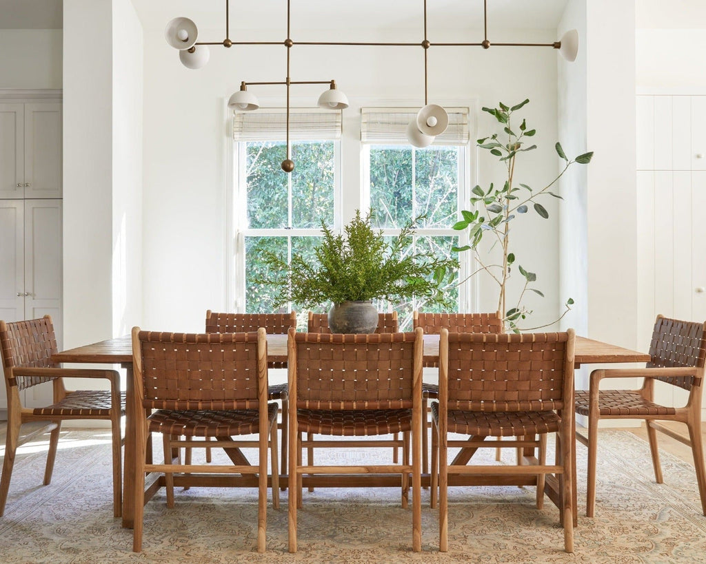 Handcrafted woven leather dining chair with teak wood frame in saddle color, second quality with natural leather variations