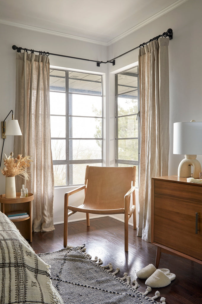 Leather Sling Lounge Chair styled in a guest bedroom with Moroccan Rug and Bhujodi Throw in Natural. - Saffron and Poe