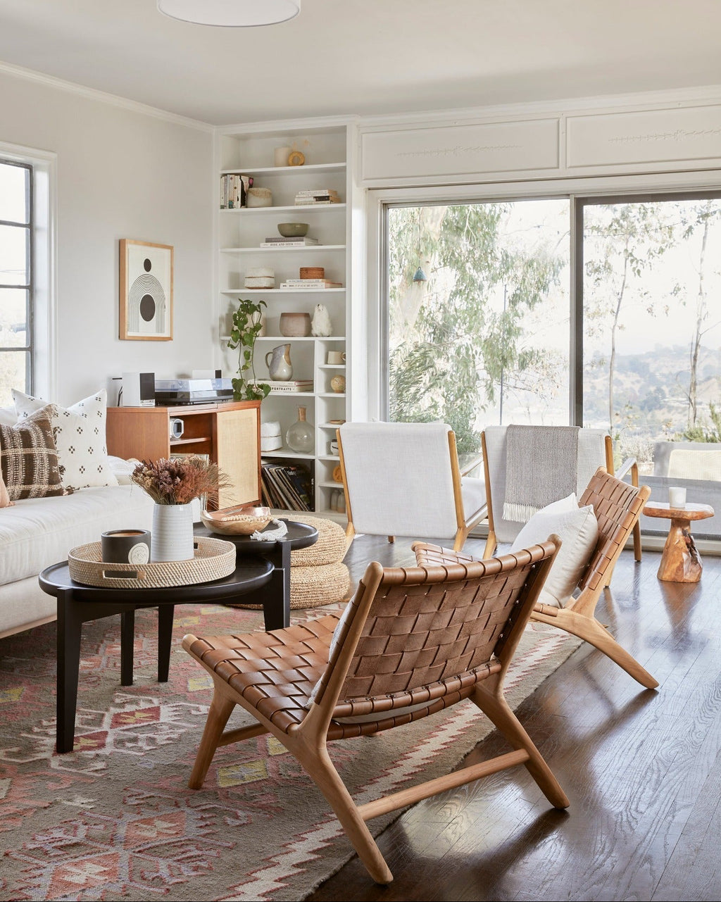 Beige woven leather lounge chair with teak frame and natural matte finish