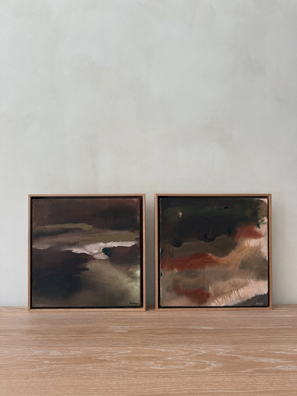 Abstract soft gradients in Untouched IV painting by Jaime Lovejoy featuring charcoal, taupe, and rust on raw canvas with natural wood frame.