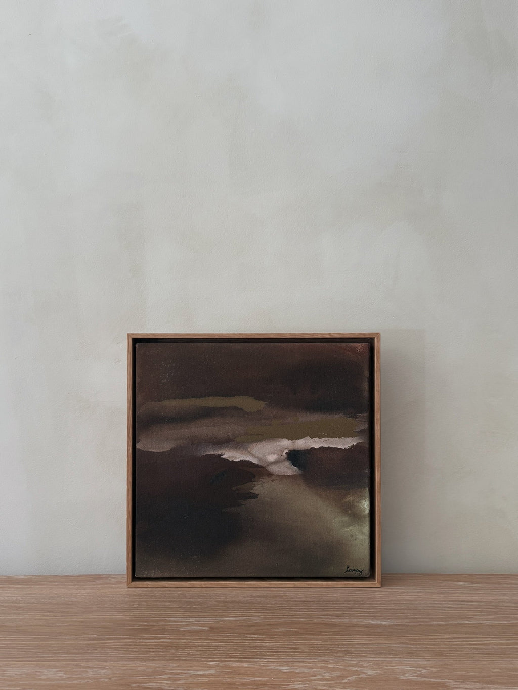 Abstract painting Untouched IV with soft charcoal, taupe, and rust gradients on raw canvas framed in natural wood.