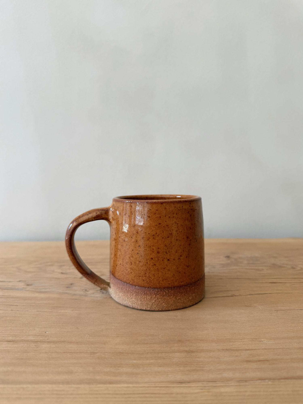 Uzumati Bronzed Rock Mug with rust-toned glaze inspired by Joshua Tree rock formations and hand-thrown ceramic design