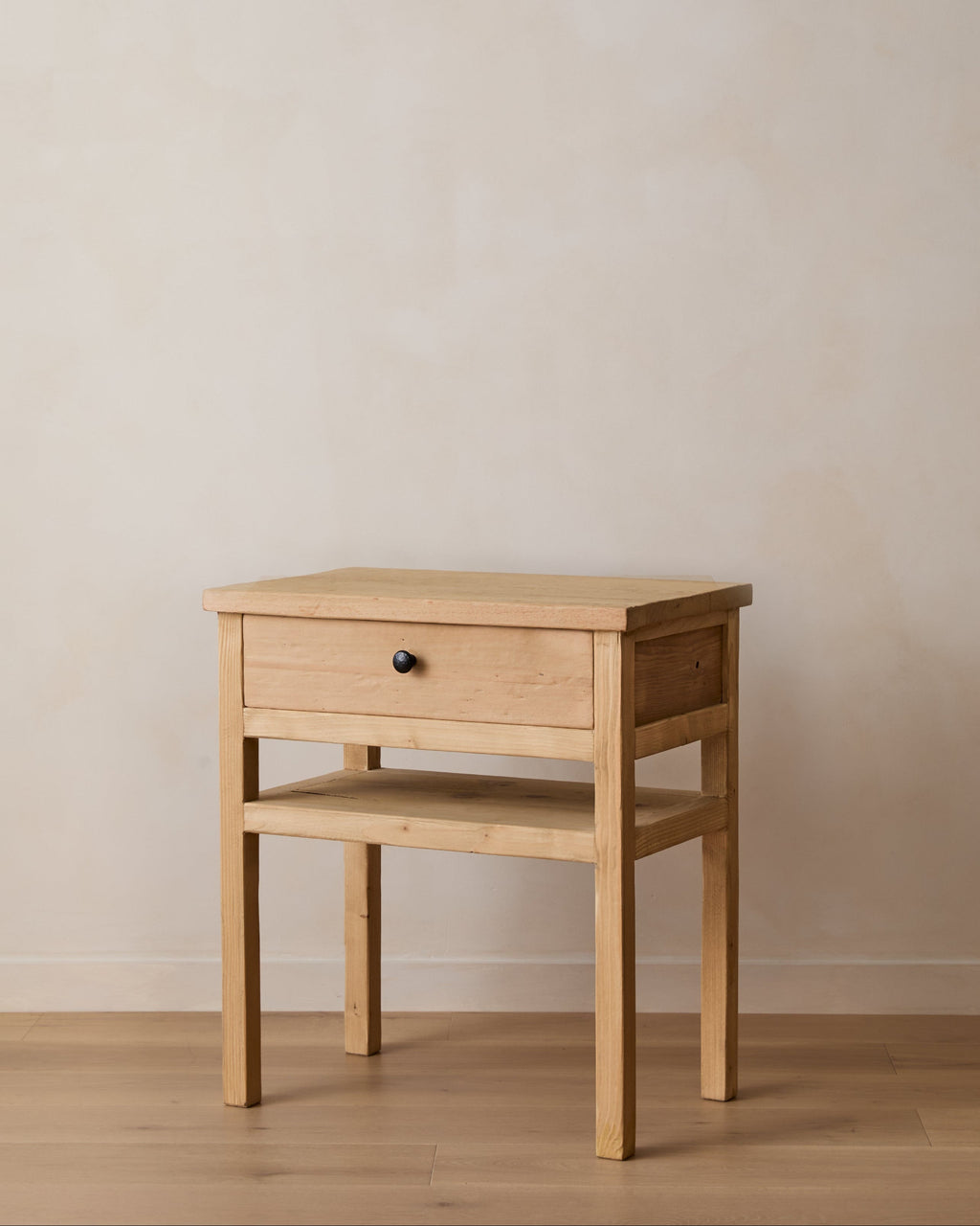 Vintage cypress bedside table made from reclaimed wood with a single drawer and open shelf, featuring a bronze knob and warm tones.