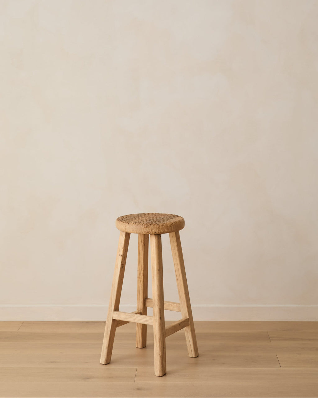 Handcrafted vintage elmwood counter stool with rustic design and sculpted seat