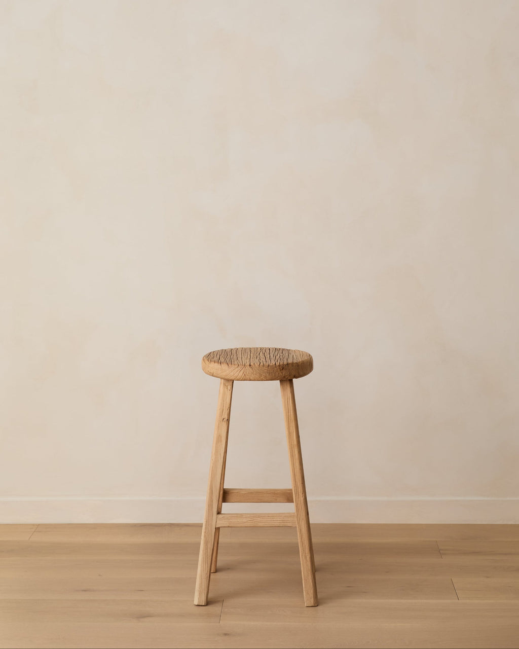 Handcrafted vintage elmwood counter stool with rustic charm and clean lines