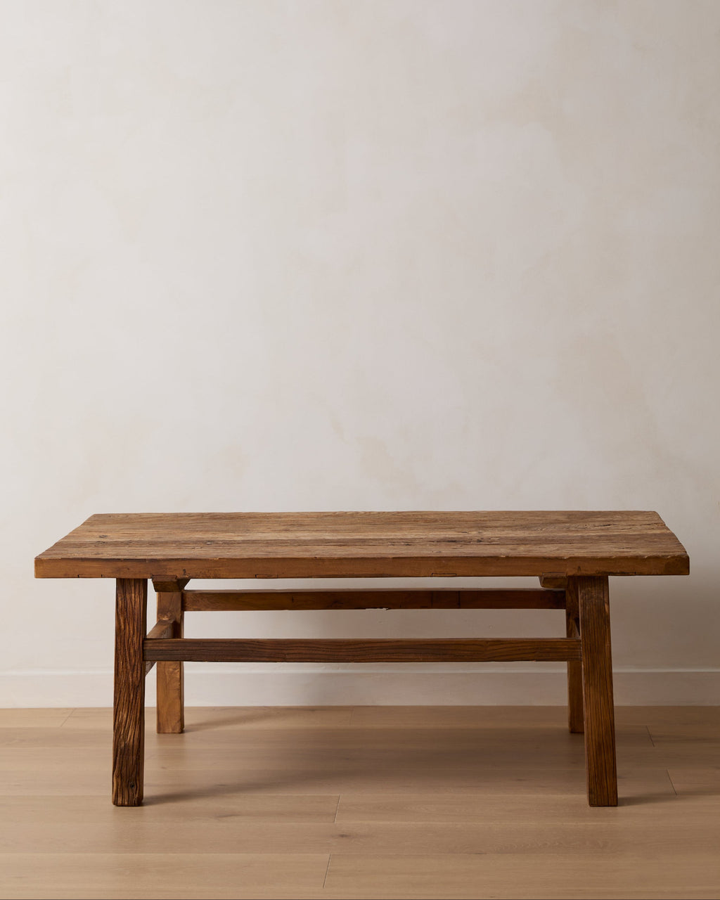 Vintage wood coffee table handcrafted from reclaimed elmwood with antique Chinese design and natural wood grain.
