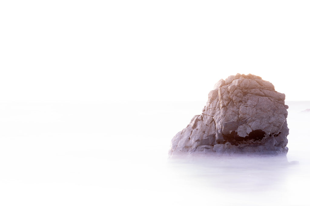 Landscape photo of cliff shrouded in fog by Mika Street for Saffron and Poe