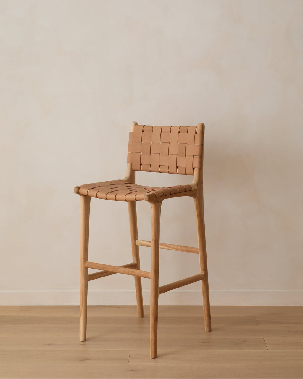 Beige woven leather bar stool with handwoven straps on teak wood frame, second quality with natural leather and wood variations
