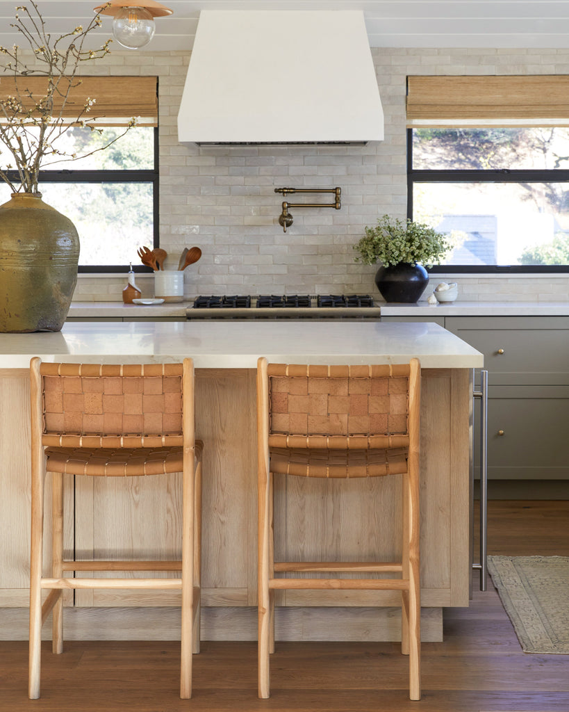 Woven Leather Counter Stool in Beige styled in modern oak and sage green kitchen