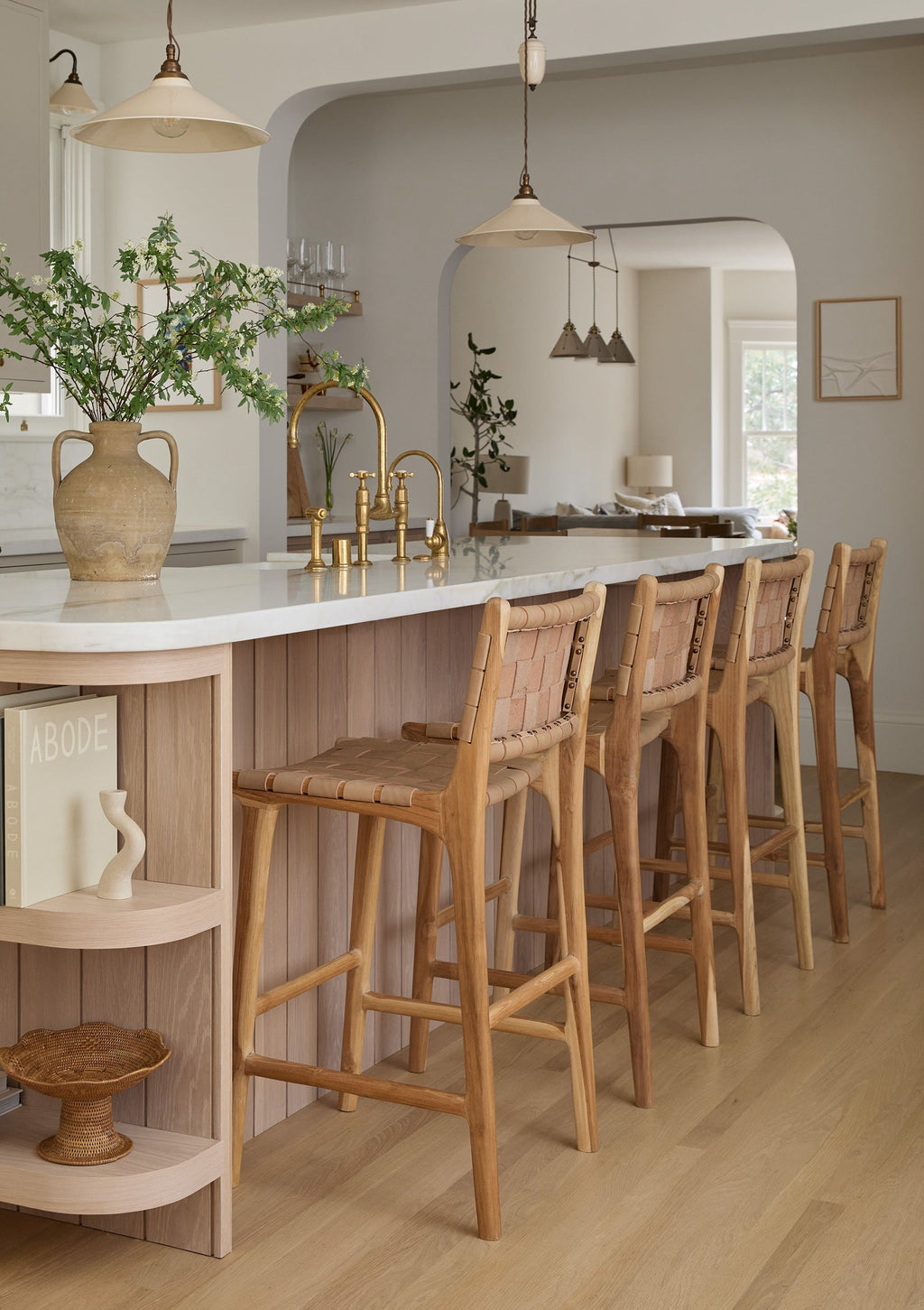 Beige woven leather counter stool with teak wood frame showcasing handwoven leather straps and natural texture