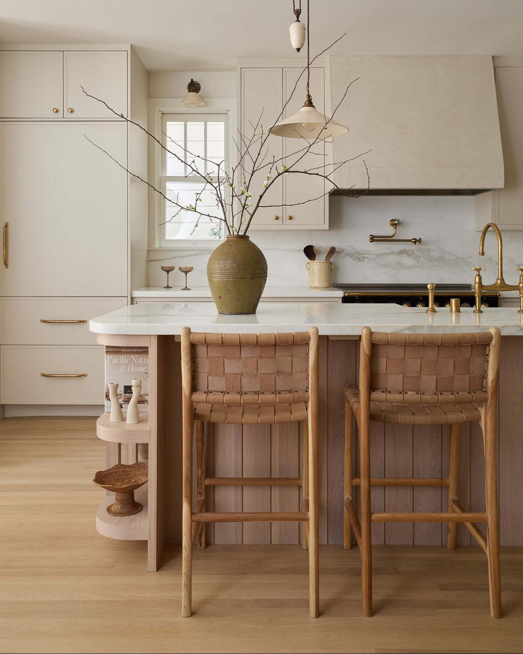 Beige woven leather counter stool with teak wood frame and handwoven leather straps