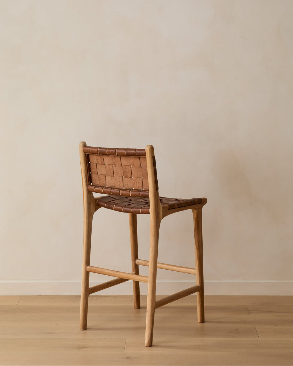Woven leather counter stool in saddle color with teak frame, handcrafted and second quality