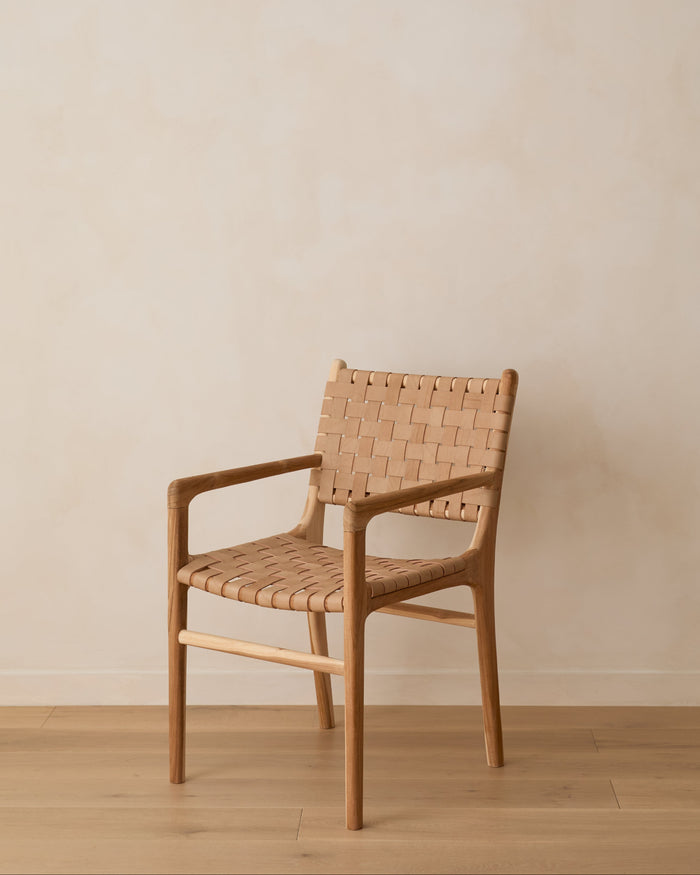 Woven Leather Dining Chair against lime washed wall and oak floor. Front Angle View.