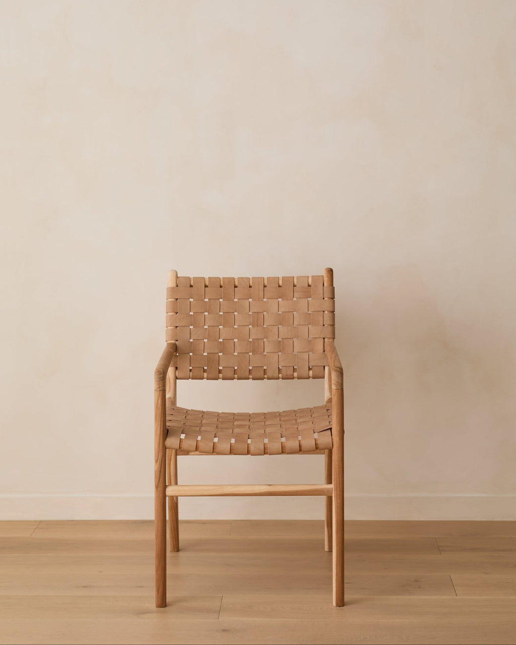 Beige woven leather dining arm chair with teak wood frame, handcrafted and second quality with natural leather variations