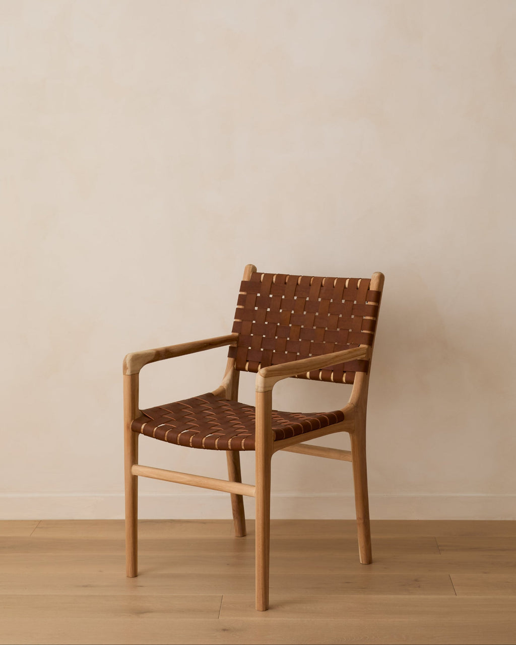 Handcrafted woven leather dining arm chair with teak wood frame in saddle color, second quality discount sale