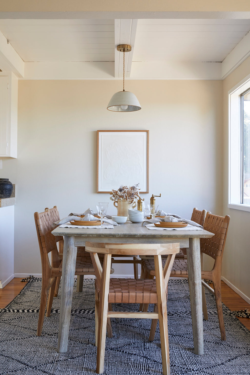 Beige woven leather dining chair with teak wood frame, handcrafted in Bali, second quality with natural leather variations