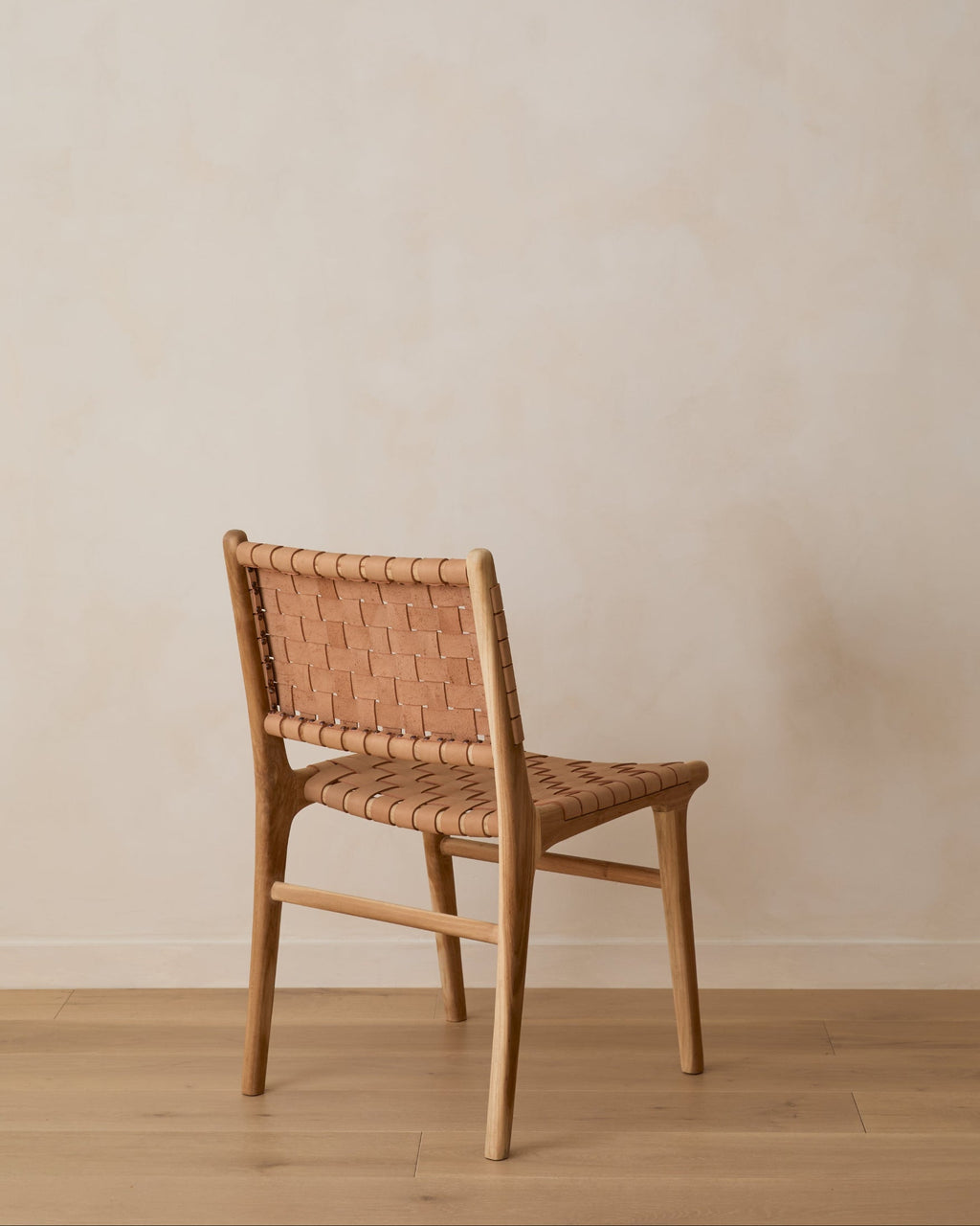 Beige woven leather dining chair with teak wood frame, handcrafted and imperfect second quality piece