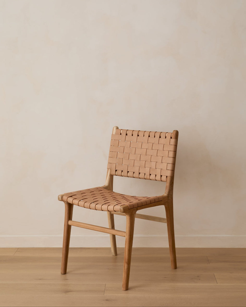 Beige woven leather dining chair with teak wood frame, handcrafted with natural leather variations, second quality sale
