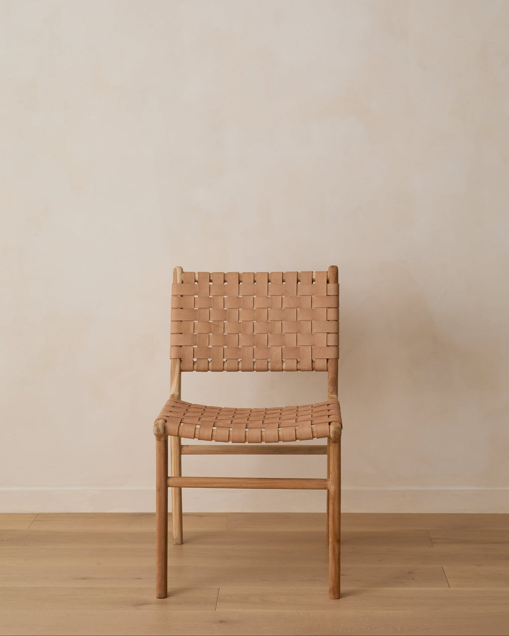 Beige woven leather dining chair with teak wood frame, second quality with natural leather variations and scuffs