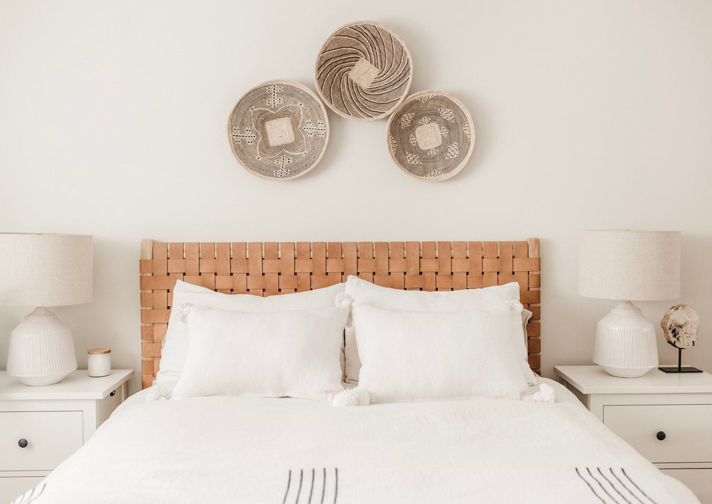 Woven Leather Strap Headboard in beige styled in bedroom. Handcrafted in Bali with teak and leather. - Saffron and Poe