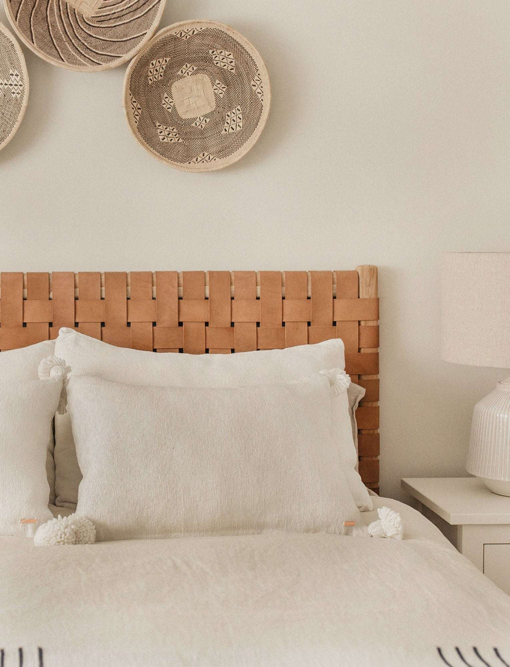 Queen size woven leather strap headboard with woven beige leather and hand-carved teak frame