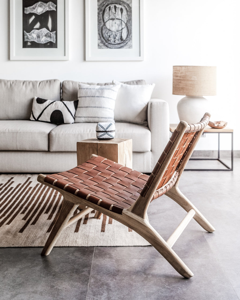 Woven leather lounge chair in saddle color with teak wood frame, handcrafted and second quality with natural variations