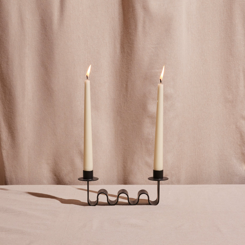 Blackened metal Ribbon Candle Holder with sculptural wave design for two taper candles