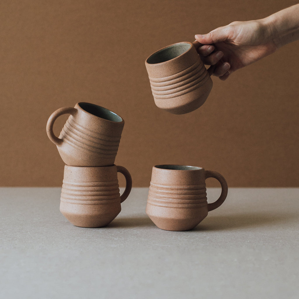 Handcrafted Anillo Mug ceramic cup with natural earth tone textures and glazed interior holding 9.5 oz