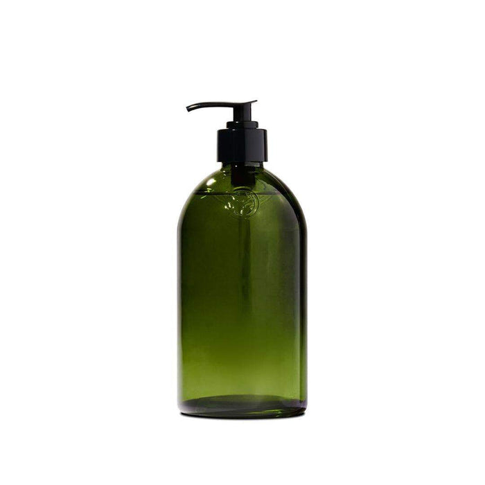 Apothecary Glass Bottle in dark green glass with a black pump dispenser and classic rounded shape