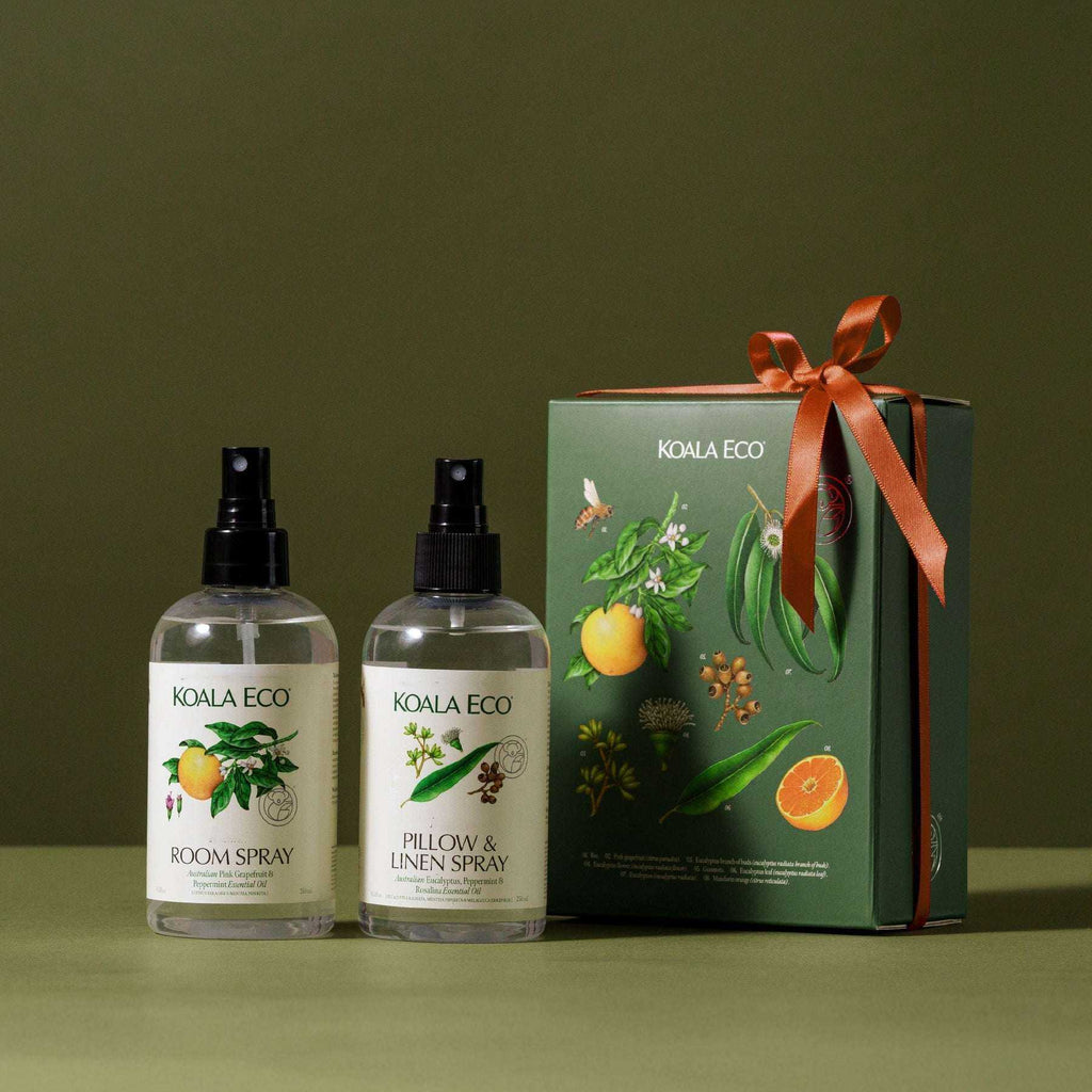 Aromatherapy Duo with two clear botanical spray bottles and a dark green gift box tied with an orange ribbon