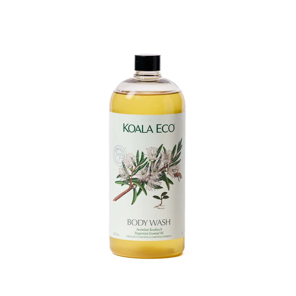 Body Wash - Rosalina & Peppermint in a clear bottle with golden liquid, a black cap and botanical plant artwork