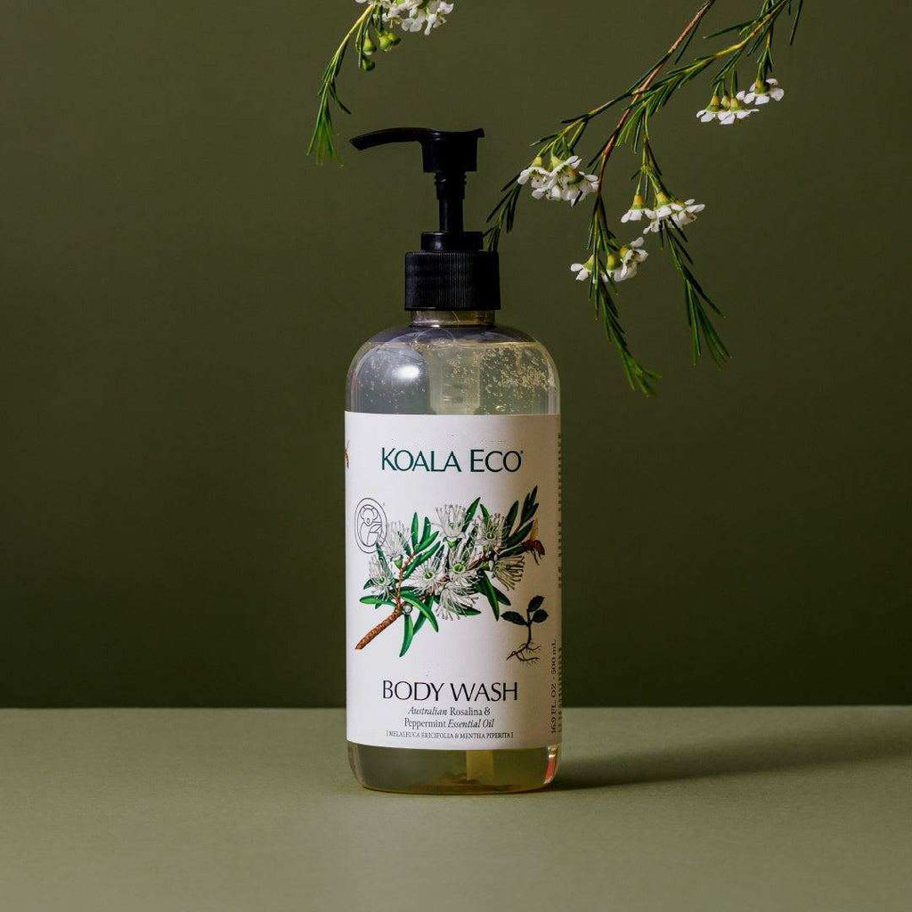 Body Wash - Rosalina & Peppermint in a clear bottle with a black pump, botanical label, and golden liquid.