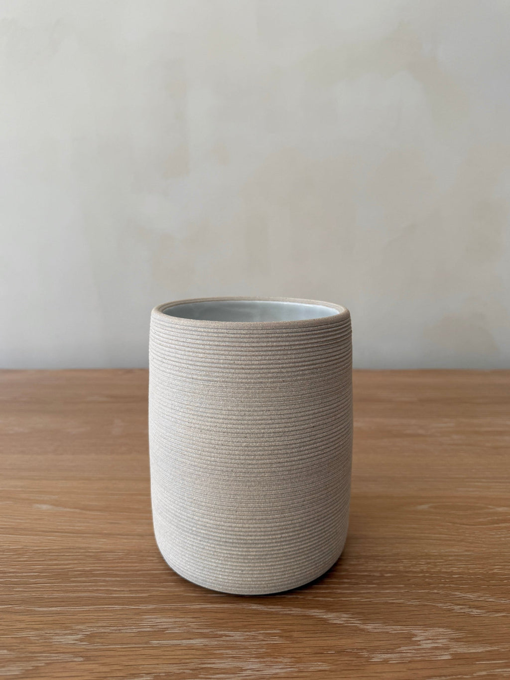 Ivory Capri Ceramic Utensil Jar with ribbed texture on kitchen countertop