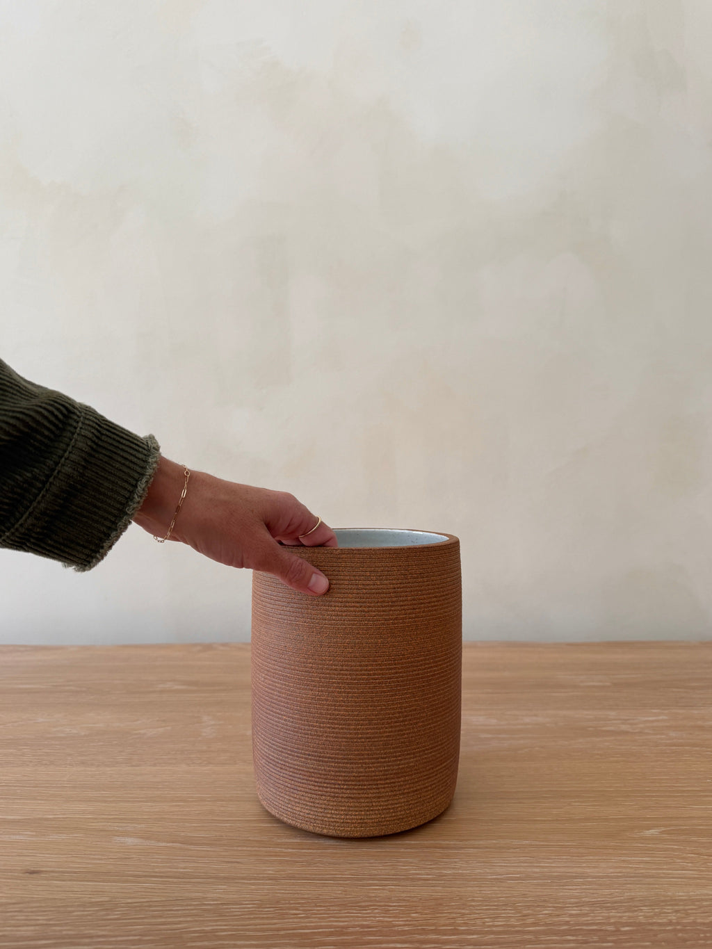 Capri Ceramic Utensil Jar in terracotta with ribbed handcrafted design on kitchen countertop