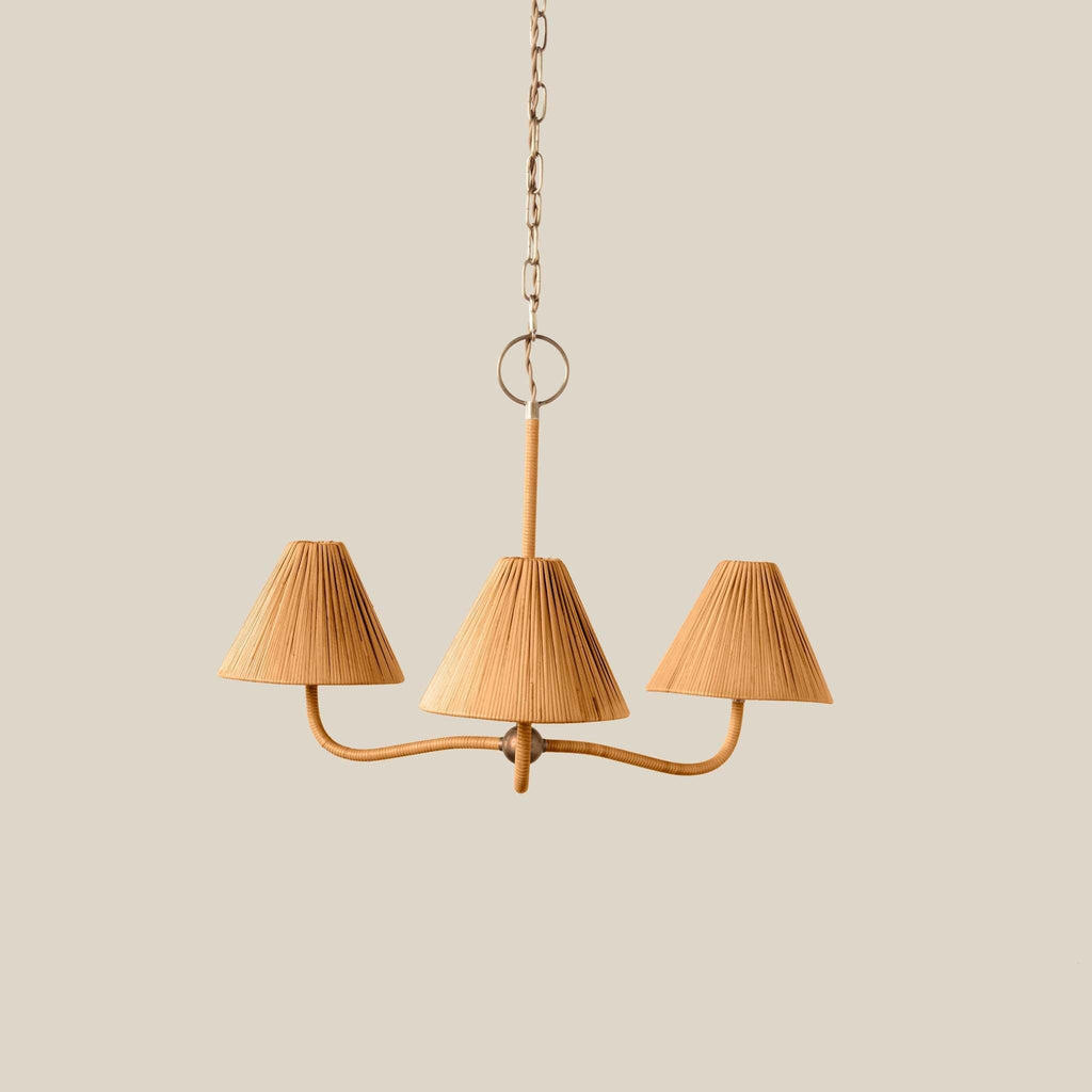 Delphine Chandelier with three natural tan rattan shades, curved arms, and warm brass-toned detailing