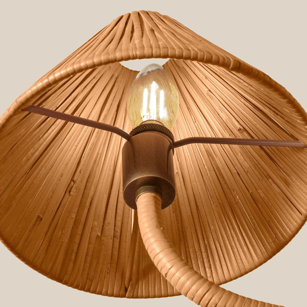 Delphine Large Chandelier with a warm natural rattan shade, ribbed woven texture, and brass-toned socket around a glowing bulb