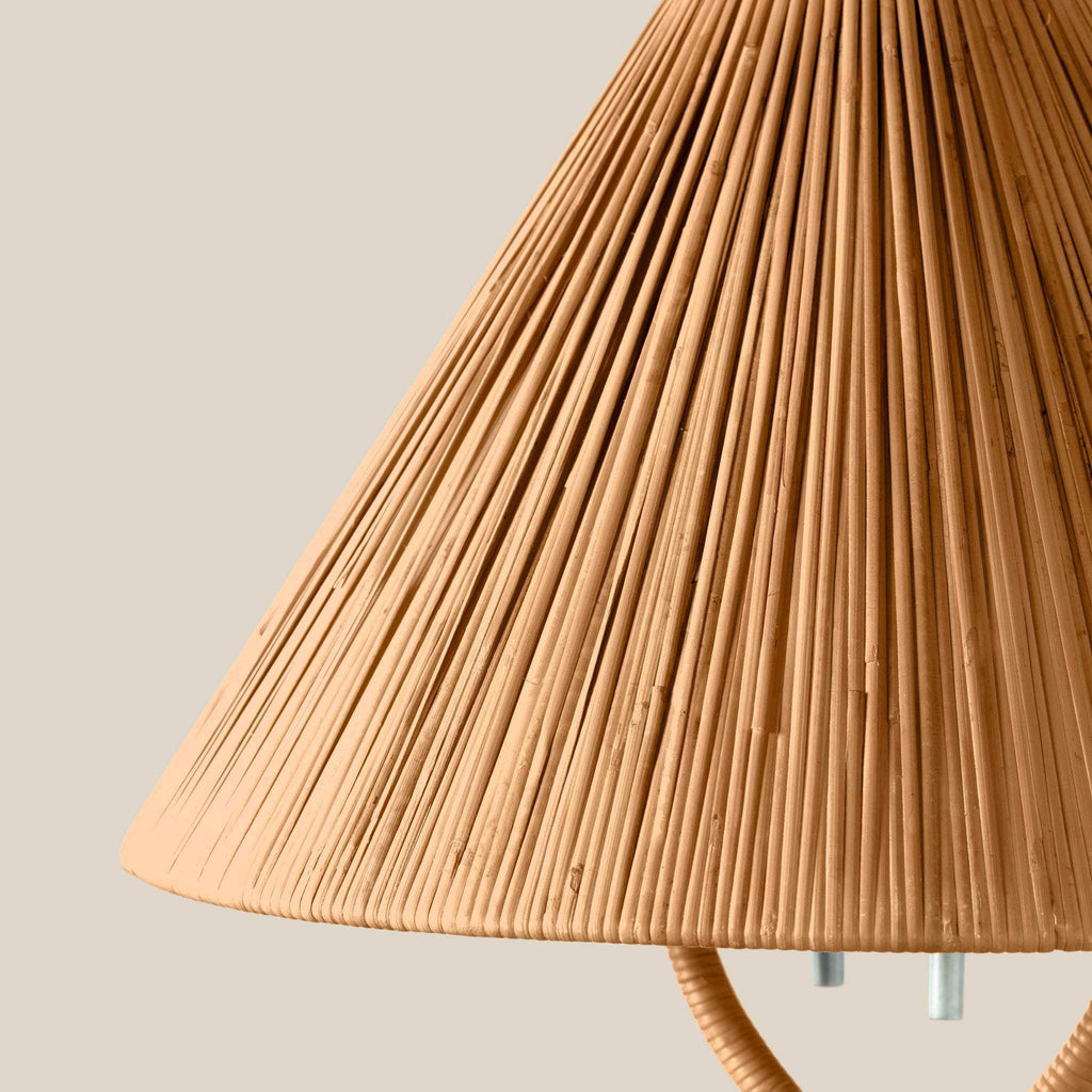 Delphine Table Lamp with a natural tan rattan shade, featuring tightly woven vertical ribs and a gently flared shape