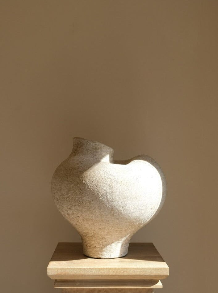 Handmade terracotta Goa vessel with organic hues and vintage finish inspired by Goa Gajah temple entrance