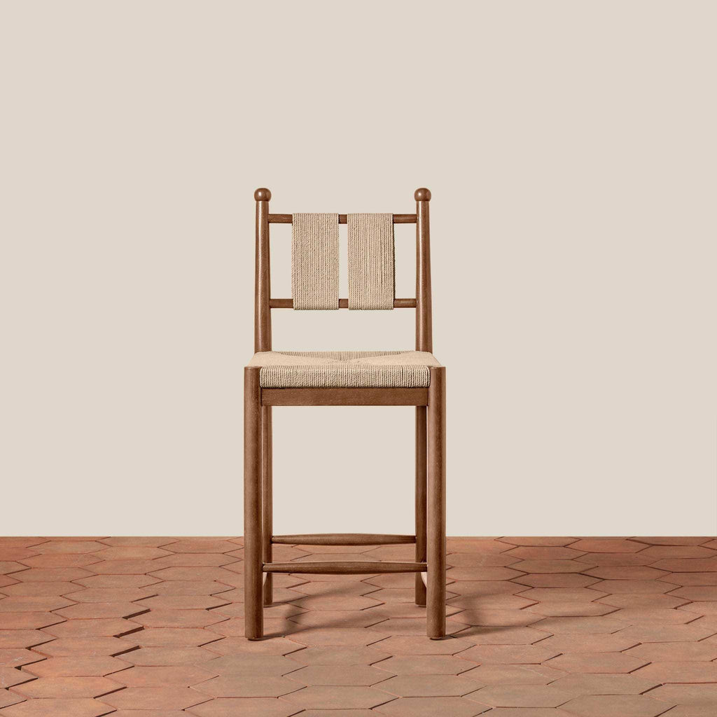 Estela Counter Stool with warm brown solid wood frame and beige woven rush seat and back
