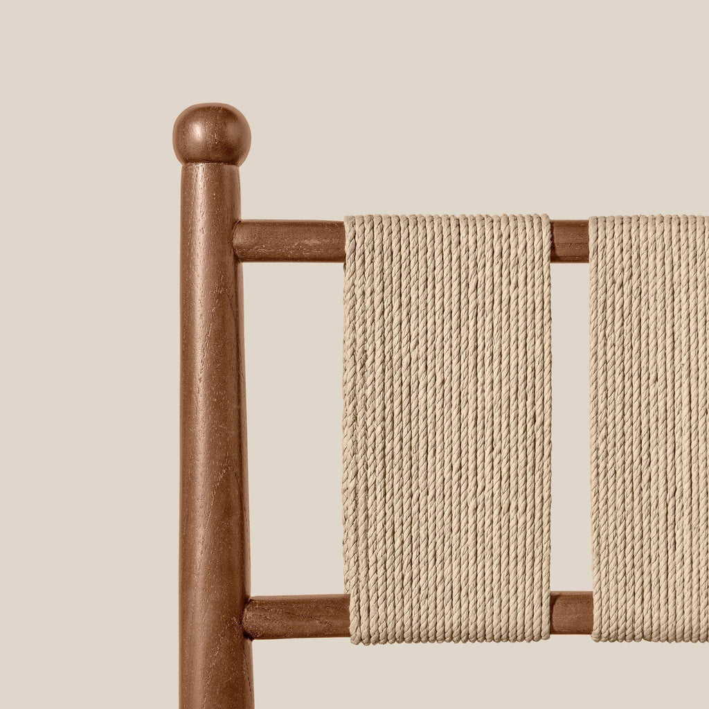Estela Counter Stool detail with warm brown solid wood frame and woven beige Danish cord back