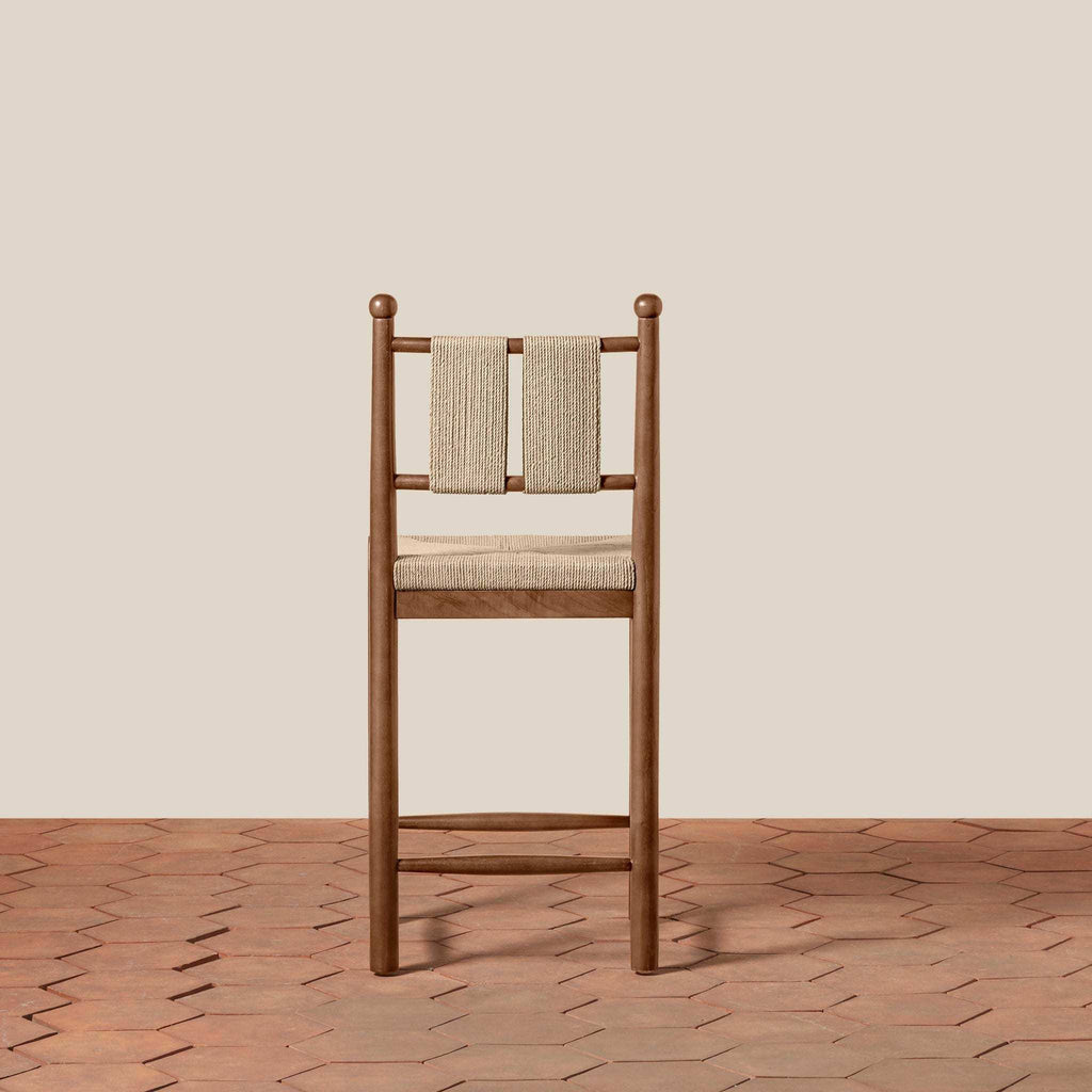 Estela Counter Stool in warm brown solid wood with woven beige cord back and rush-pattern seat
