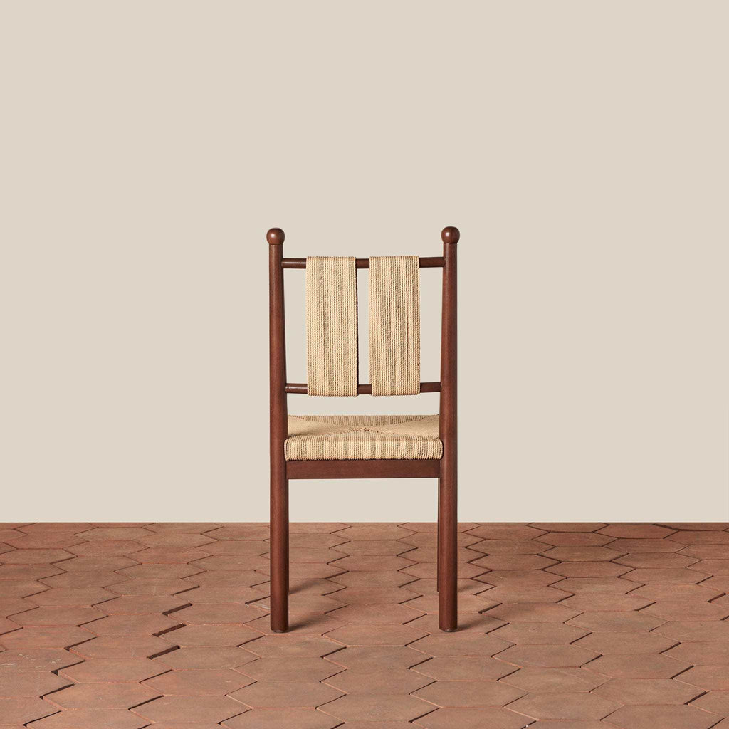 Estela Dining Chair with a dark wood frame, woven rush seat, and woven Danish cord back