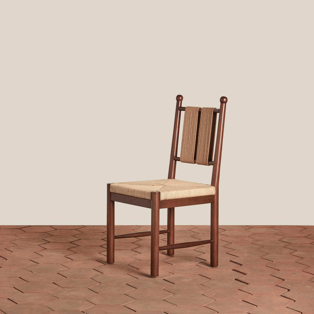 Estela Dining Chair in dark wood with a woven tan seat and vertical woven backrest
