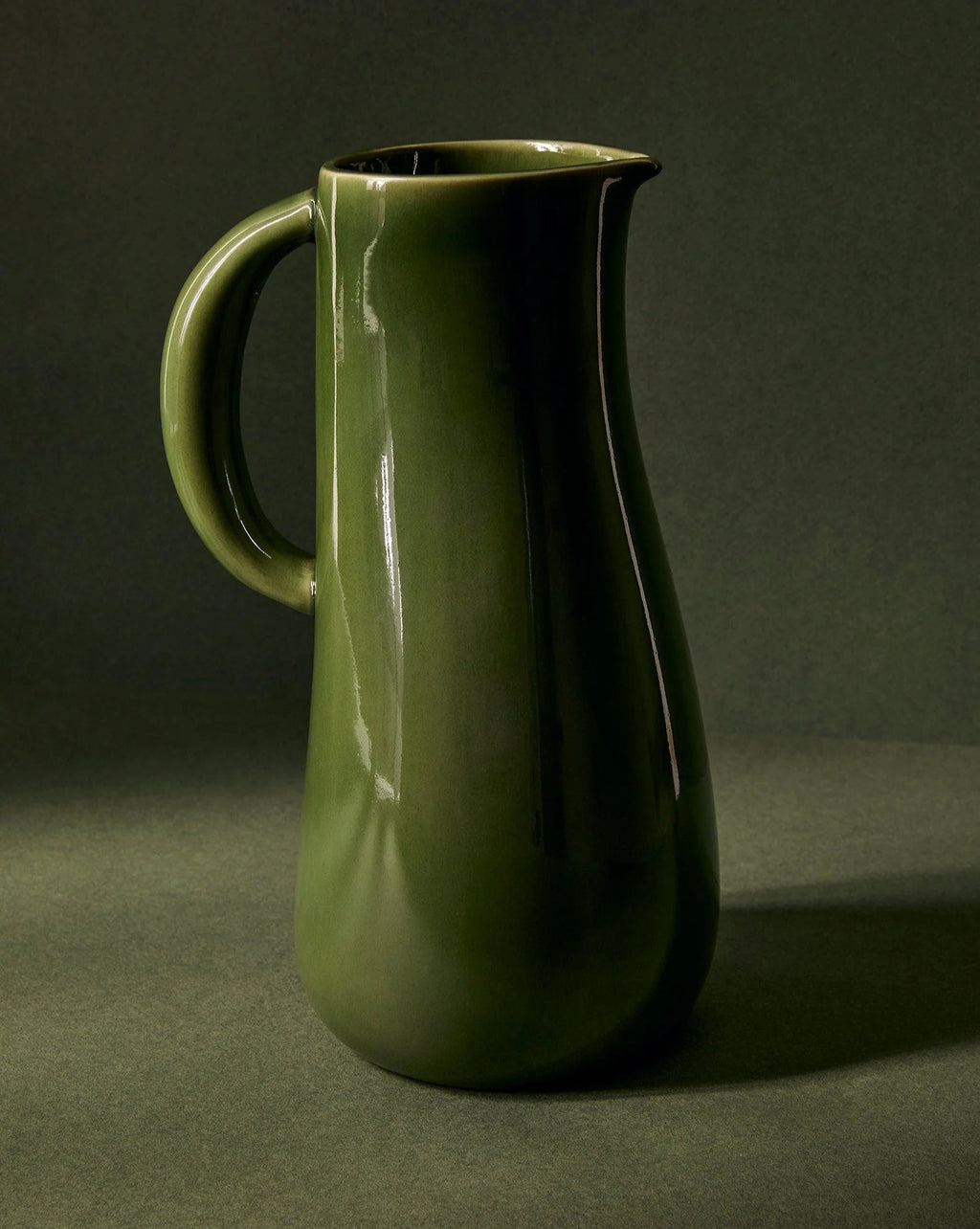 Handcrafted stoneware jug with green glaze, 50 oz capacity, handmade in Tunisia, food safe and microwave safe.