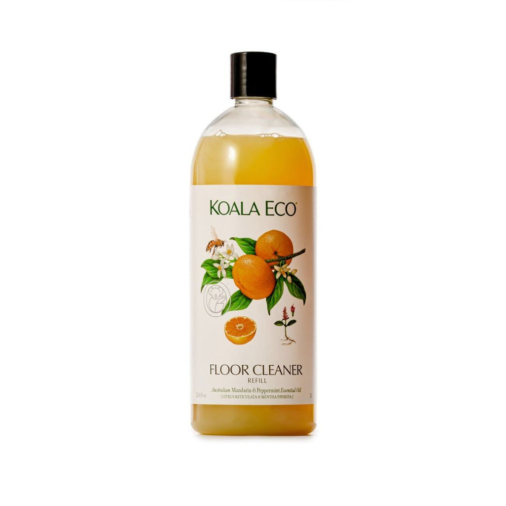 Floor Cleaner - Mandarin + Peppermint in a clear amber-tinted bottle with a black cap and citrus botanical label