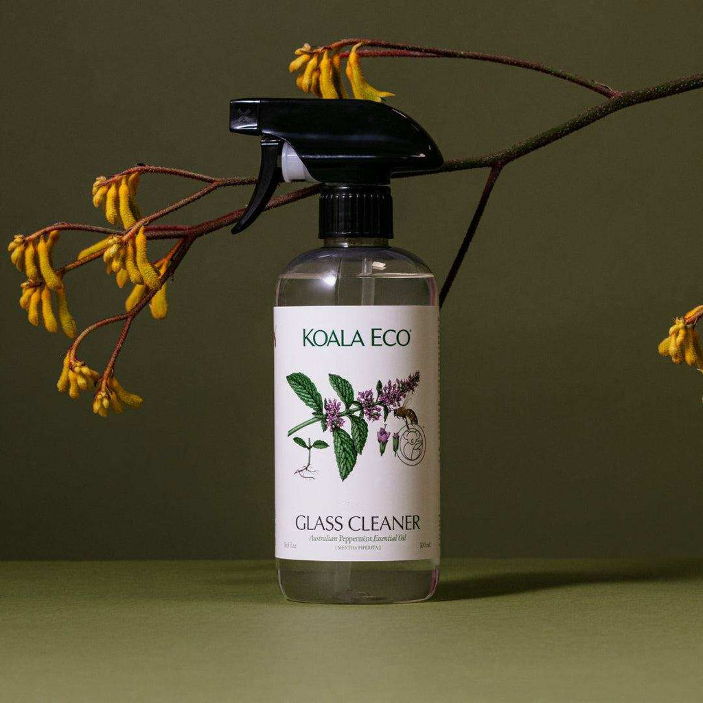 Glass Cleaner in a clear spray bottle with black trigger, white botanical label, and peppermint illustration