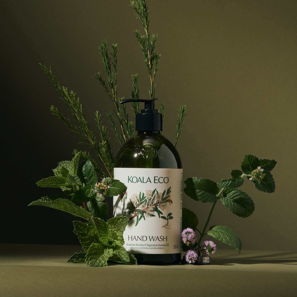 Hand Wash - Apothecary Glass in a dark green reusable bottle with a black pump and botanical label